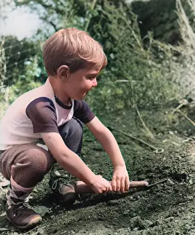 Little boy playing in a garden