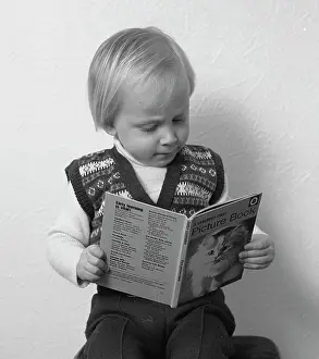 Tony Boxallfrps: Little boy reading a picture book