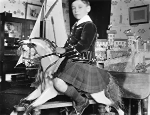 Snooty: Little boy on rocking horse