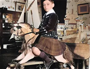 Privileged: Little boy on rocking horse