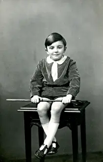 Finery: Little boy sitting on a stool