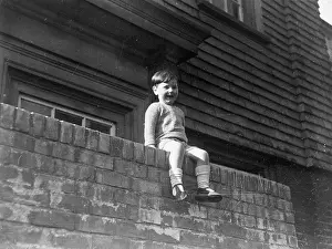 The Childrens Society: Little boy sitting on a wall
