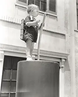 Firecracker: Little boy standing on giant firecracker prop