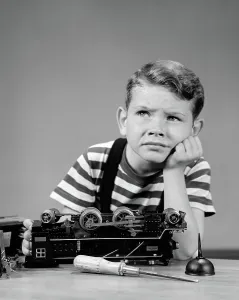 Solving: Little boy thinking or worrying about broken