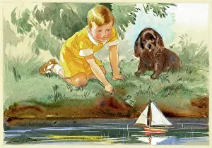 Little boy with toy sailing boat