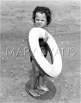 LITTLE GIRL AT THE BEACH