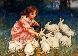 Bunnies: Little girl feeding rabbits