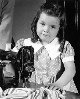 Ov201912: Little girl learning to sew