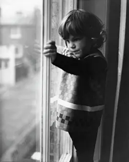 The John Krish Collection: Little girl looking through a window