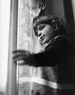 The John Krish Collection: Little girl looking through a window