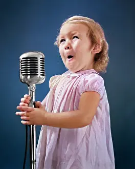 Audition: Little Girl Making Face Singing Into
