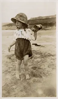 Sunhat: Little girl playing on the beach