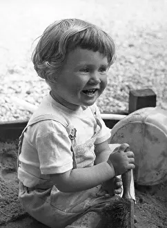 Sandpit: Little girl playing in sandpit