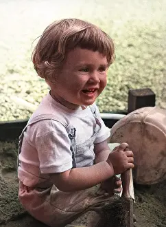 Sandpit: Little girl playing in sandpit