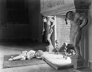 Exhausting: Little girl sleeping in front of a fireplace