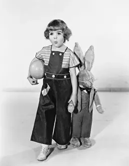 Startle: Little girl standing with a Easter bunny