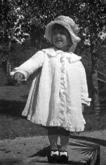 C1917: Little girl in a white coat
