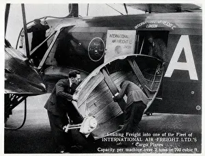 Handlers: Loading a boat via the side door of a cargo plane