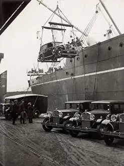 Visitation: Loading English luxury cars onto a ship