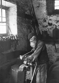 Locksmith: A locksmith Austria. About 1900. Photograph