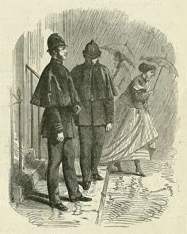 Raining: London policemen wearing rain capes
