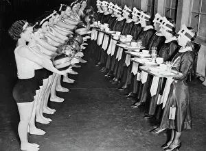 Waitresses: In a London restaurant gymnasts juggle