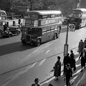 Wick: London rush hour, people at a bus stop