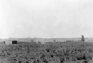 Huffman: Long-range view of machine on launching track, showing hanga