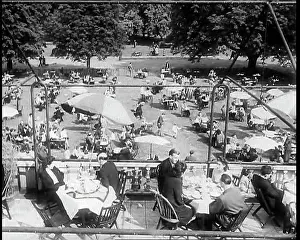 Serpentine: Looking Down on the Roof Terrace of a Busy