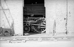 Bedford: Looking across tracks to detail of steam engine in shed