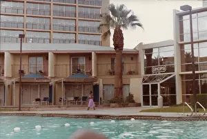 Lorna Holder walking by the swimming pool