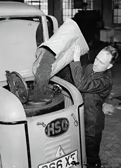 Coals: A lorry is filled with anew solid