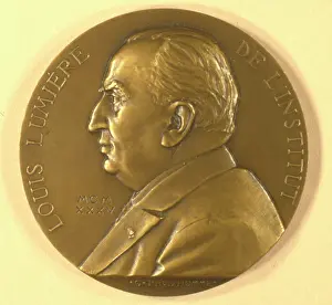 Lumiere: Louis Lumiere portrait on a coin