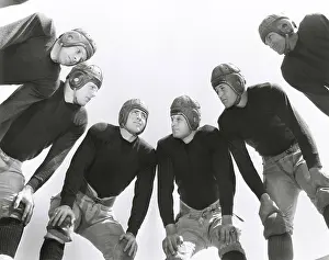 Huddle: Low angle view of football huddle