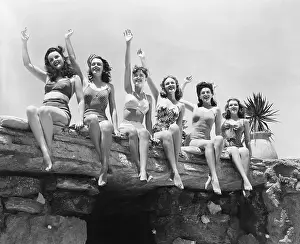 Thrill: Low angle view of a group of women sitting on a