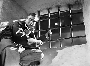 Deceit: Low angle view of a young man trying to escape from