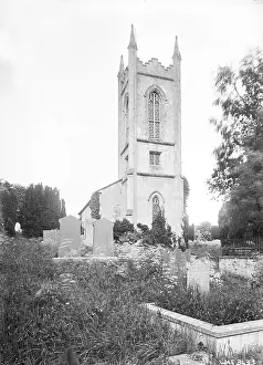 Newry: A low view of a Church from the graveyard