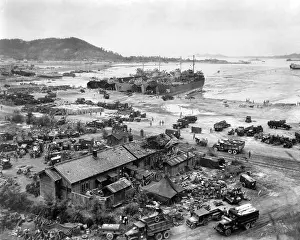 East Asia: Four LST's unload men and equipment on Red Beach