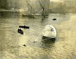 Dragged: Lt Col Orde Lees being dragged through the water after d