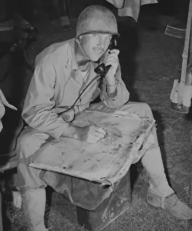 Colonels: Lt. Col. Raymond Murray taking a message over
