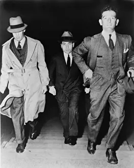Mobsters: Lucky Luciano (1896-1962), being escorted ?