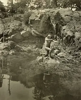 Lcgr2003: Lummi man shooting fish with bow and arrow