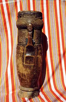 Lunda: Lunda carved cylindrical drum with image of human face