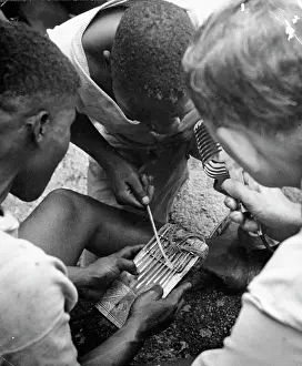 Mbira: Luvale men playing Likembe mbira. Nine notes with one
