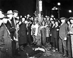 Intolerance: Three lynched African American men, two hanging