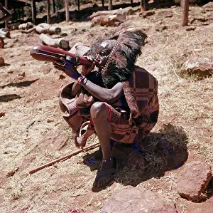 Pastoralists: Maasai elder drinking from a beaded gourd