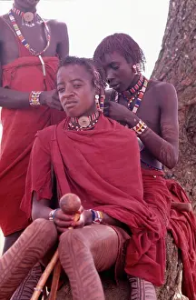 Beadwork: Maasai morans preparing for a ceremony