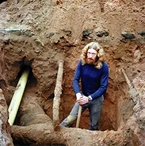 Macclesfield: Macclesfield, Cheshire - Road Worker excavating around pipes