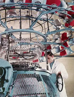 Employee: A machine collects coloured yarn onto rolls