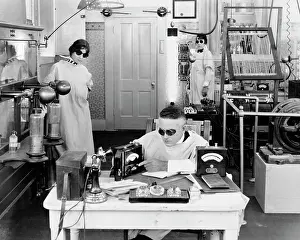 Inventing: Three Mad Scientists Working Experimenting Inventing